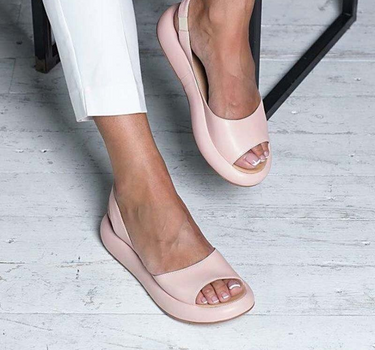 Pink Women’s Casual Footbed Slip-On Sandals on the model