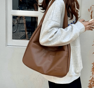 Women’s Brown Spacious Leather Shoulder Bag on model