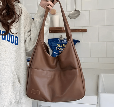 Women’s Brown Spacious Leather Shoulder Bag on model