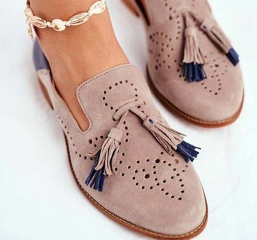 Khaki Women’s Classic Tassel Slip-On Loafers on the model