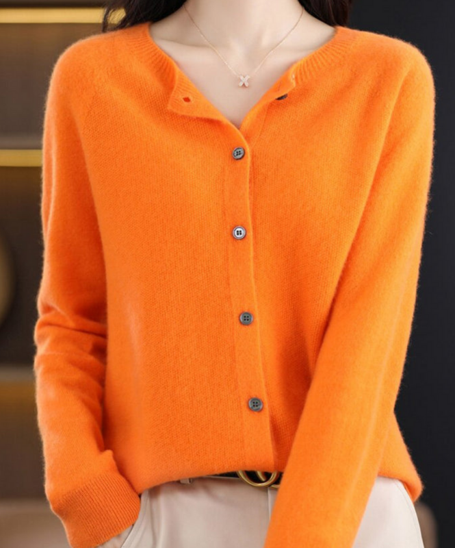 Orange Women’s Elegant V-Neck Button-Detailed Sweater on the model