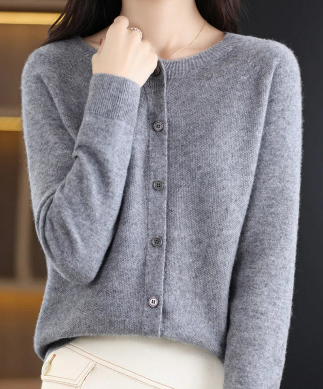 Gray Women’s Elegant V-Neck Button-Detailed Sweater on the model