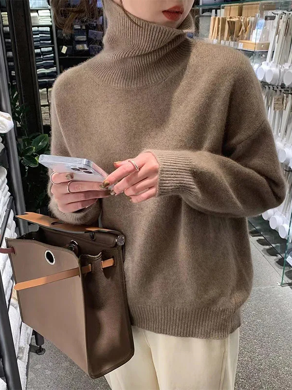 Coffee Women’s Soft Classic Fit Turtleneck Sweater on the model