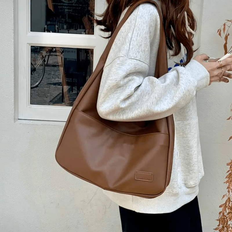 Women’s Brown Spacious Leather Shoulder Bag on model