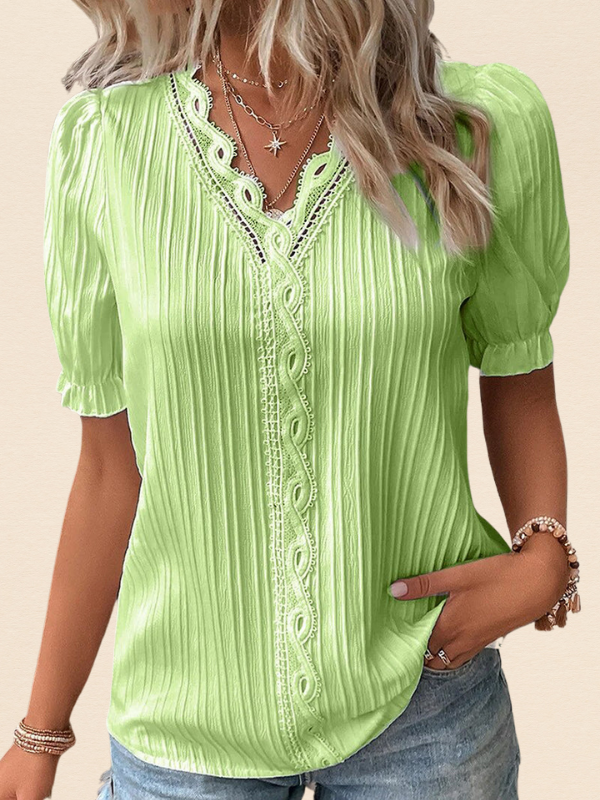 Green Women’s Puff Sleeve V-Neck Blouse on the model