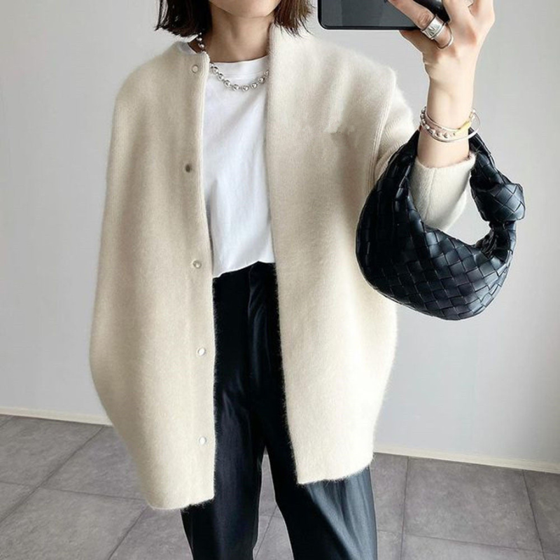Cream Women’s Elegant Knit Cardigan Pocket Detail on model