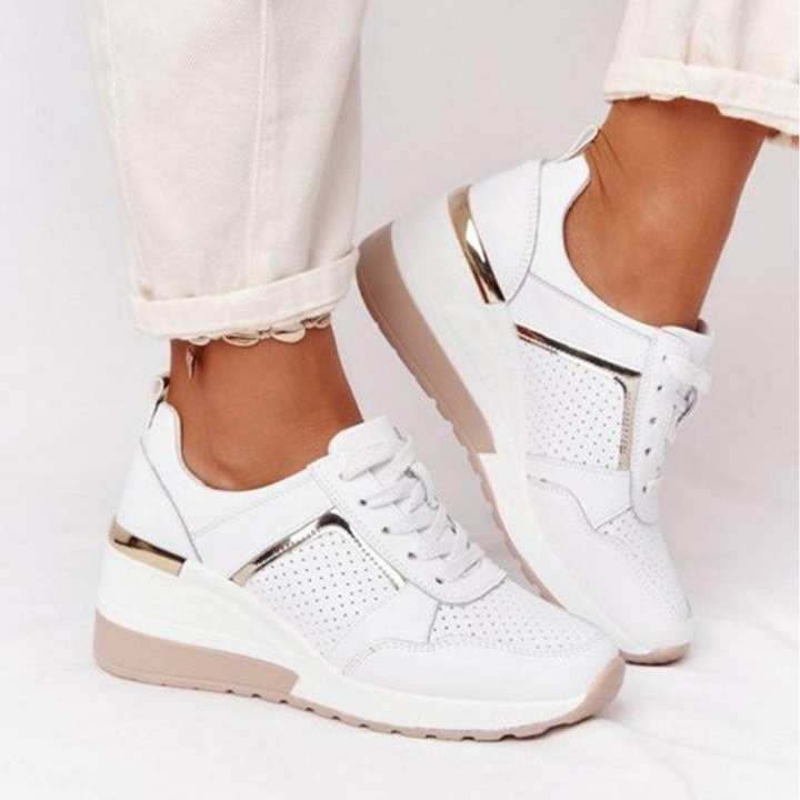 White Women’s Orthopedic Comfort Heel Sneakers on the model