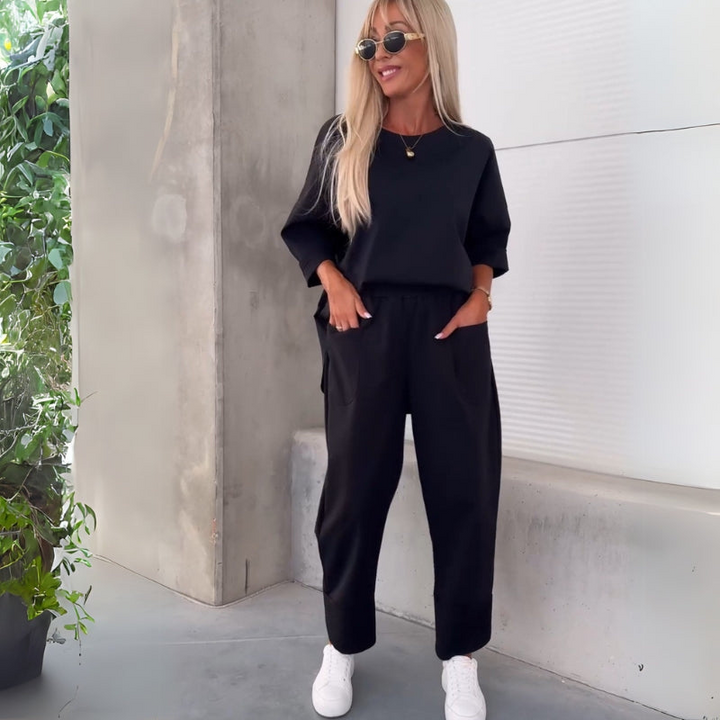 Black Women’s Coordinated Minimalist Fit Tracksuit Set on the model