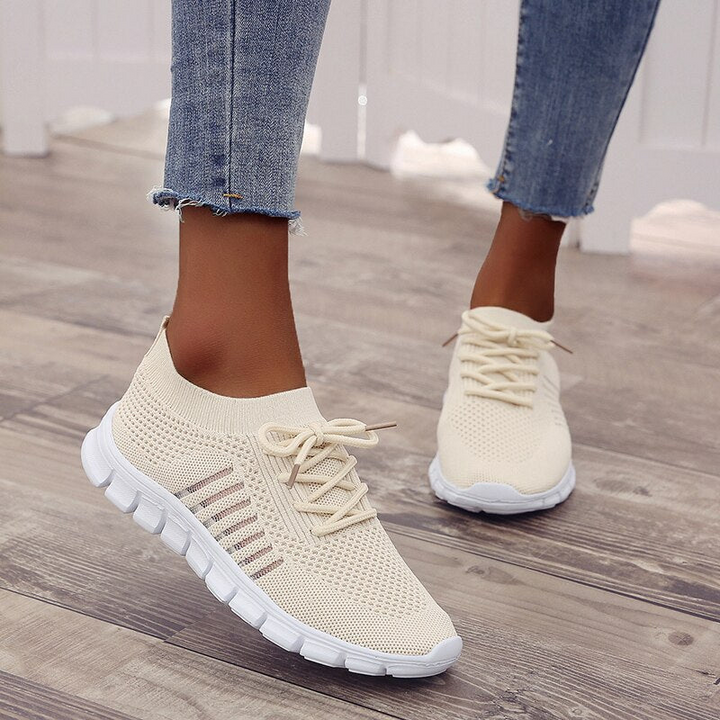 Cream Women’s Breathable Mesh Walking Sneakers on the model