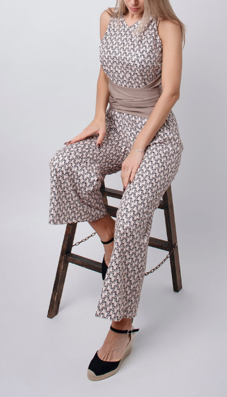 Beige Women’s Sleeveless Round Neck Fitted Jumpsuit on the model