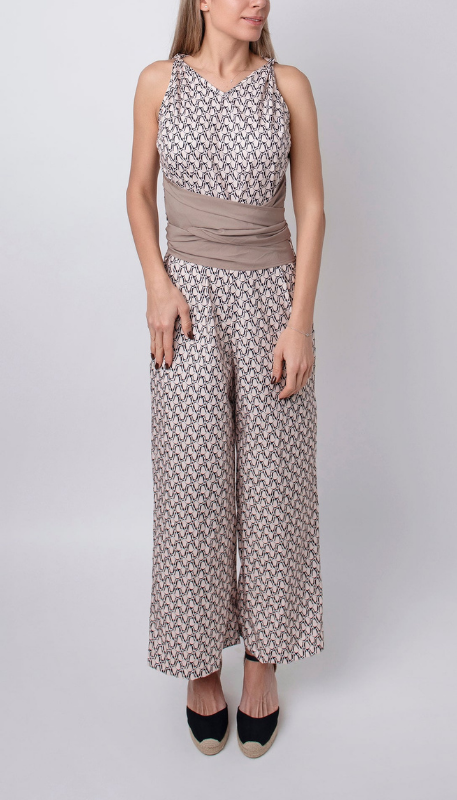 Beige Women’s Sleeveless Round Neck Fitted Jumpsuit on the model