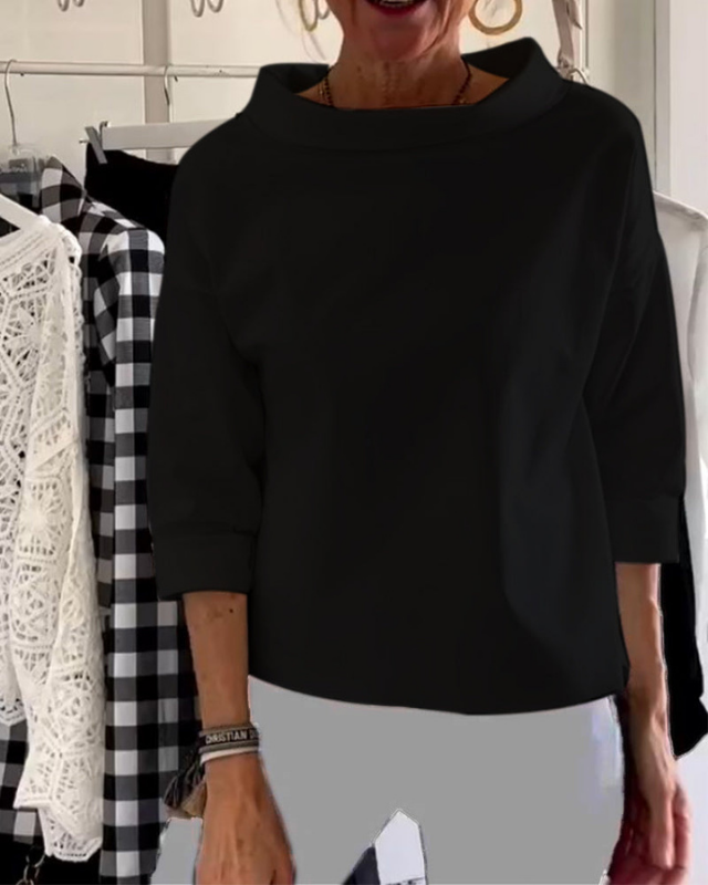 Black Women’s 3/4 Sleeve Relaxed Fit Boat Neck Blouse on the model