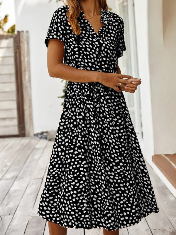Black Women’s Breezy Printed Midi Summer Dress with Short Sleeves on the model