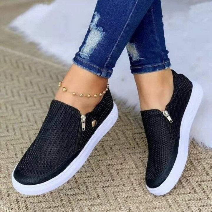 Black Women’s Elegant Comfort Fashion Sneakers on the model