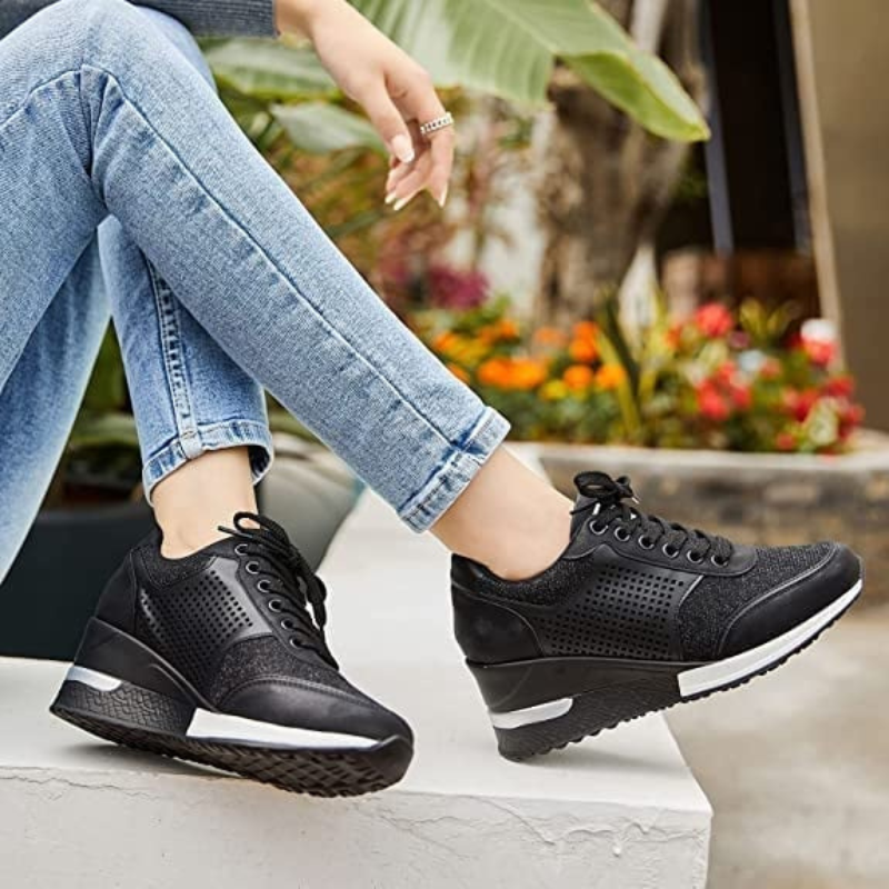 Black Women’s Hidden High-Heeled Wedge Mesh Fit Trainers on the model