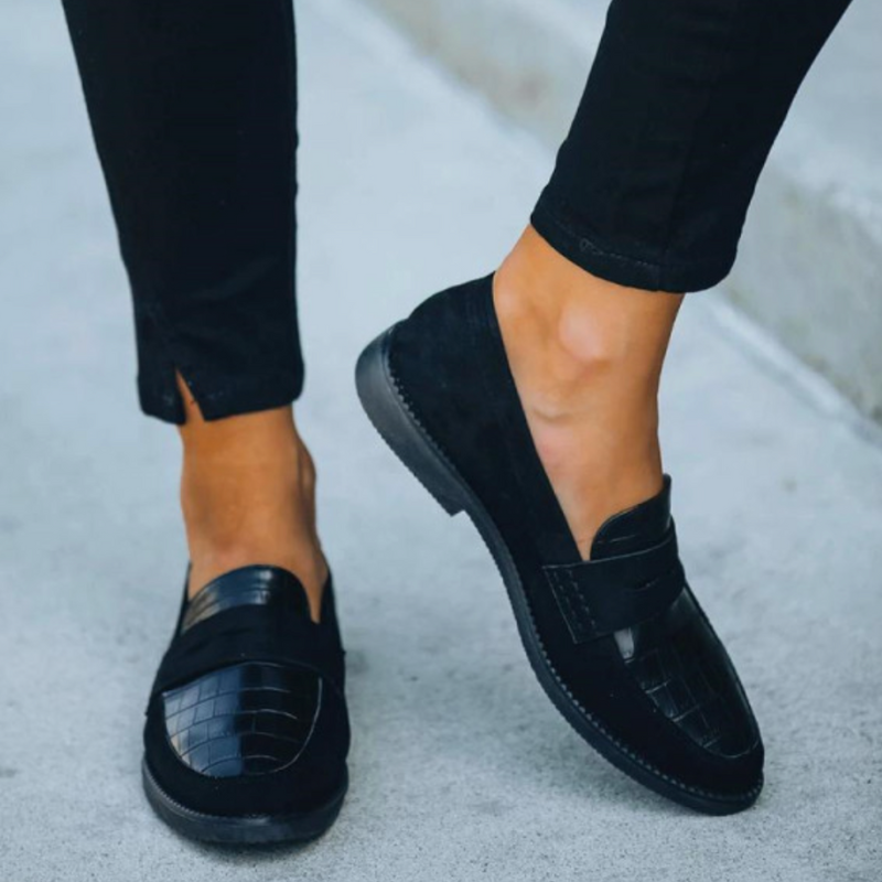 Black Women’s Timeless Luxury Comfort Loafers on the model