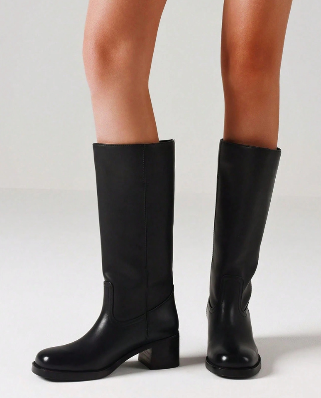 Black Women’s Insulated Comfort Knee-High Boots with Everyday Edge on the model