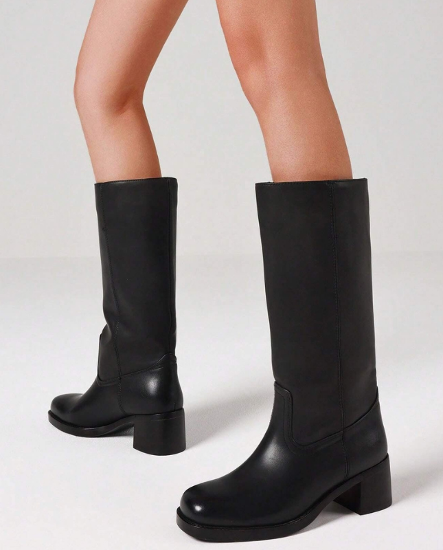 Black Women’s Insulated Comfort Knee-High Boots with Everyday Edge on the model