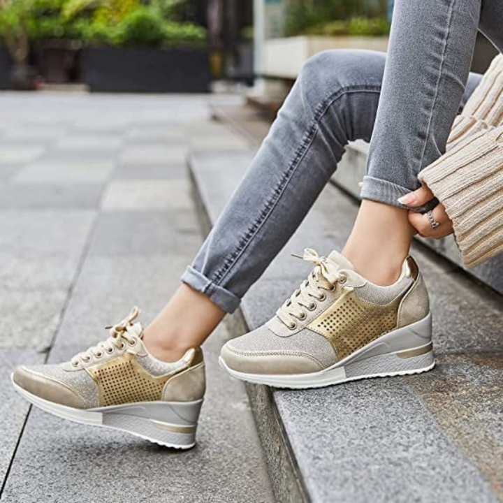 Gold Women’s Hidden High-Heeled Wedge Mesh Fit Trainers on the model