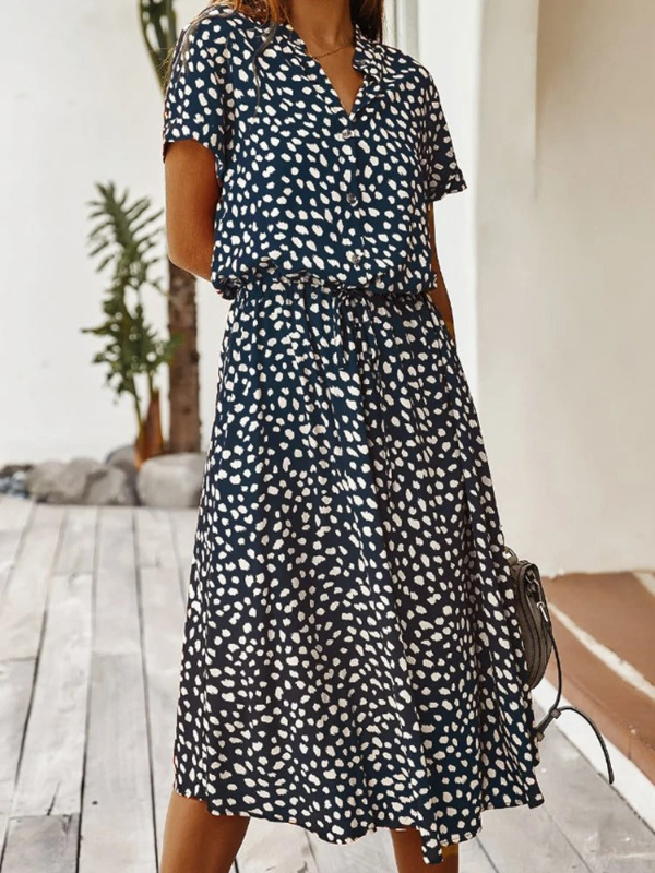 Navy Blue Women’s Breezy Printed Midi Summer Dress with Short Sleeves on the model