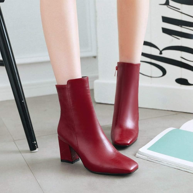 Red Women’s Sleek Side-Zip Ankle Boots with Comfortable Heel on the model