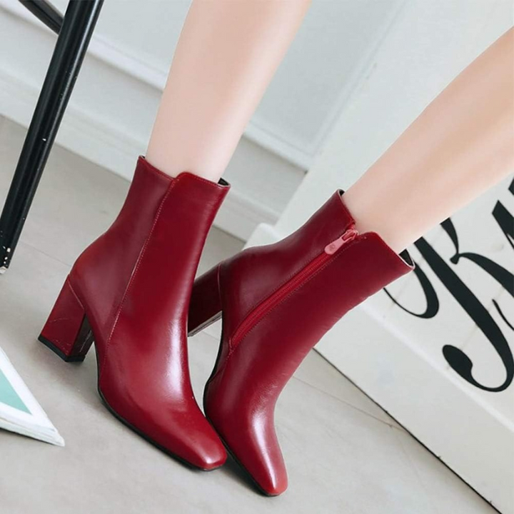 Red Women’s Sleek Side-Zip Ankle Boots with Comfortable Heel on the model