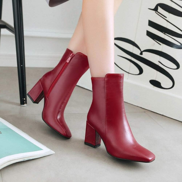 Red Women’s Sleek Side-Zip Ankle Boots with Comfortable Heel on the model