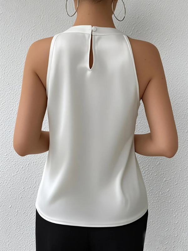 White Women’s Elegant Pleated Halter Neck Blouse on the model