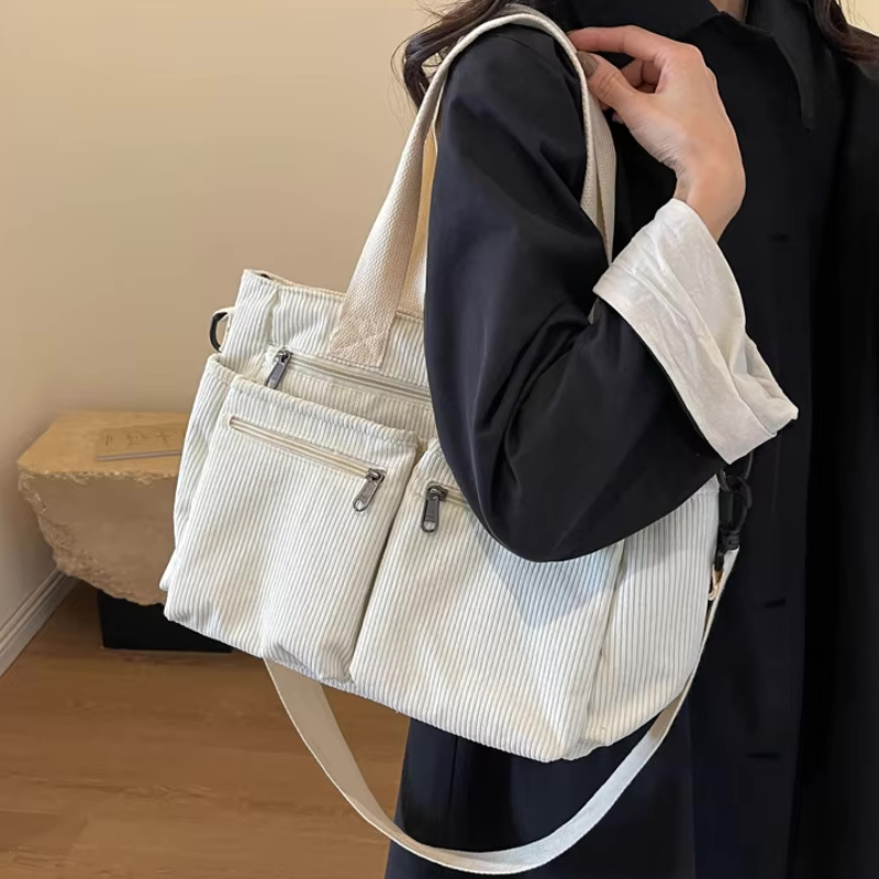 White Women’s Everyday Multi-Pocket Bag on the model