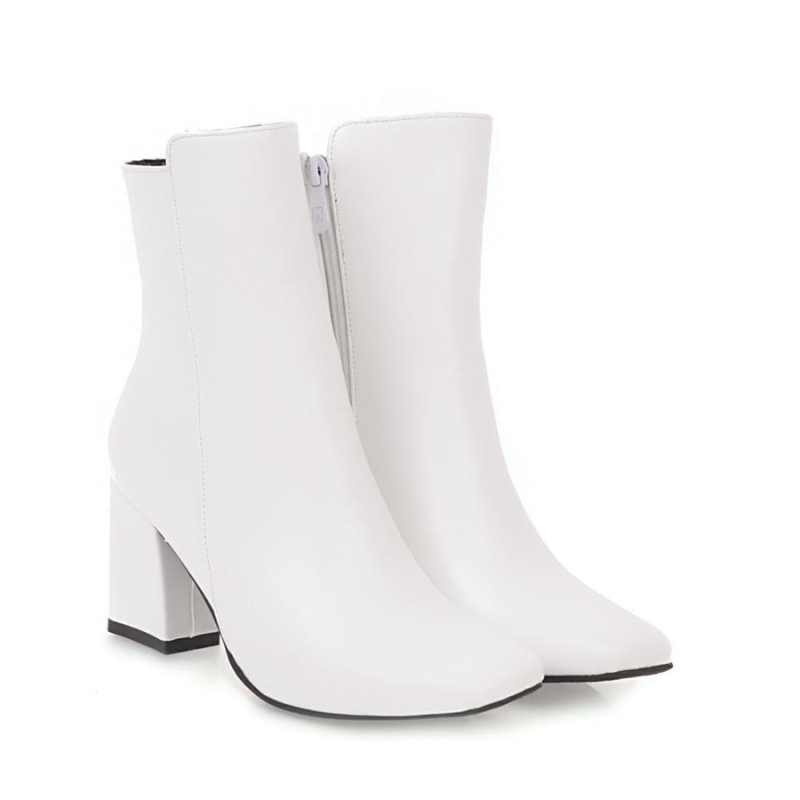 White Women’s Sleek Side-Zip Ankle Boots with Comfortable Heel on the model