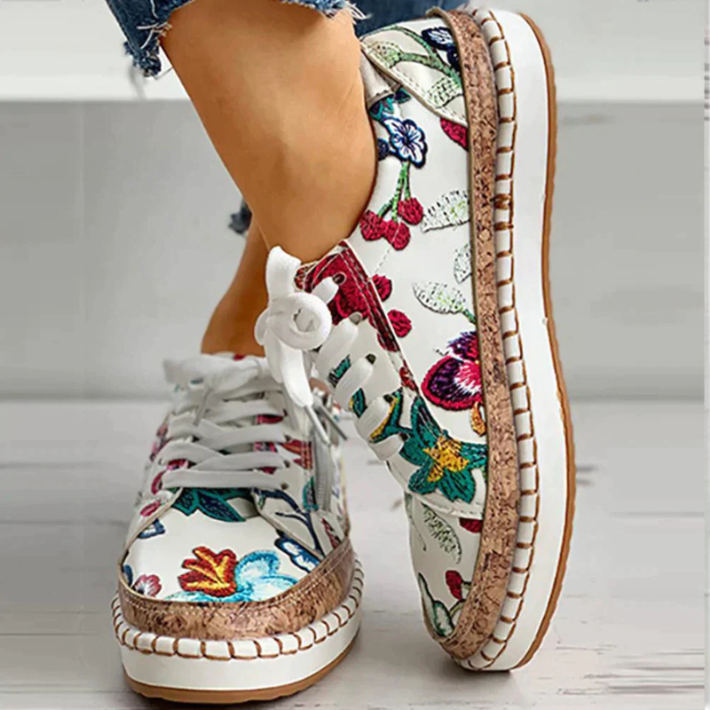 White/Red Women’s Embroidered Breathable Comfort Slip-On Shoes on the model