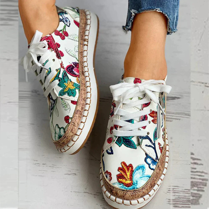 White/Red Women’s Embroidered Breathable Comfort Slip-On Shoes on the model
