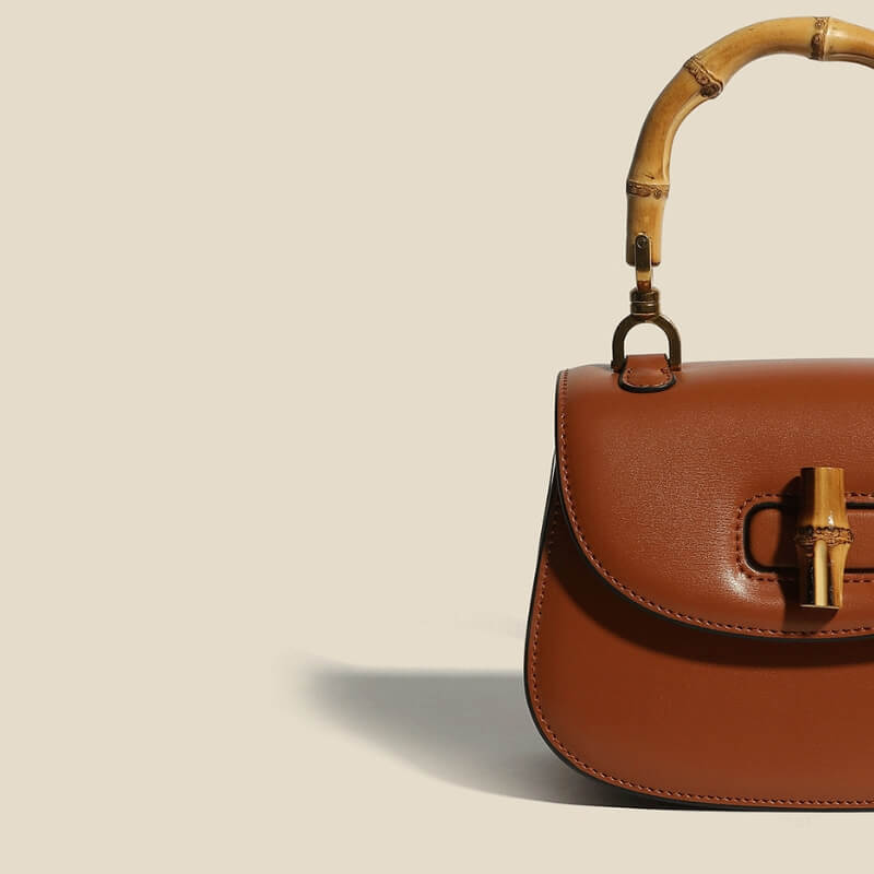 Women's Leather Handbag with Bamboo Detailing and Adjustable Shoulder Strap