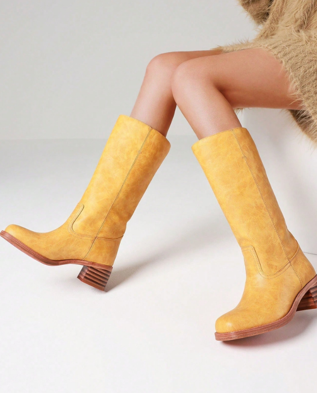 Yellow Women’s Insulated Comfort Knee-High Boots with Everyday Edge on the model